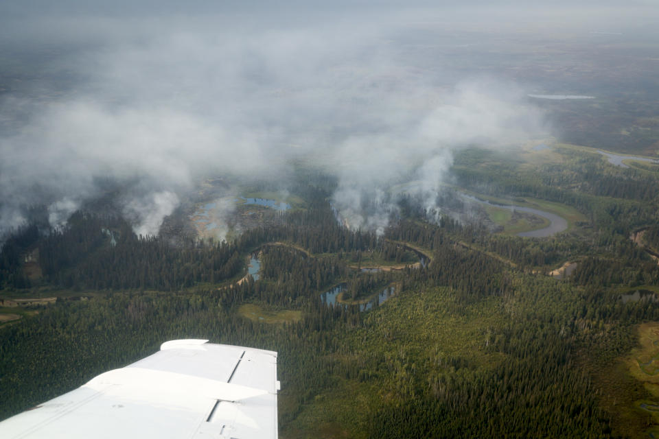 A small wildfire burns south of Enterprise, N.W.T., Thursday, Aug. 17, 2023. THE CANADIAN PRESS/Jeff McIntosh