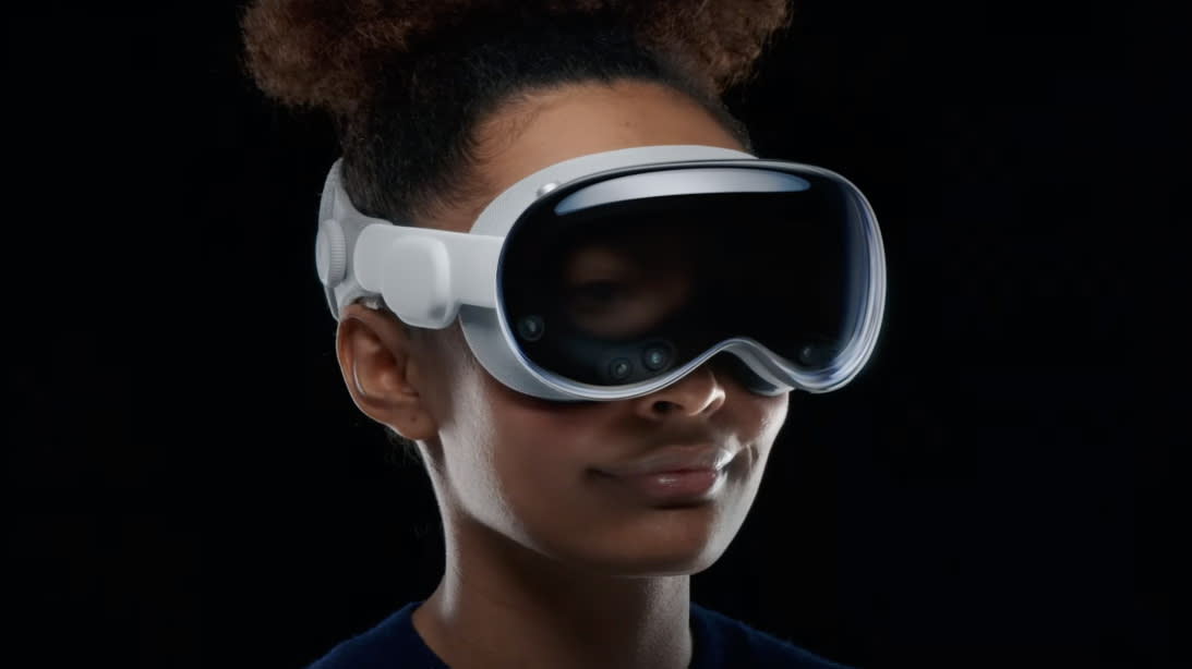  A woman wearing the Apple Vision Pro headset 