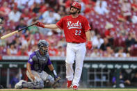 Cincinnati Reds' Wade Miley (22) flips his bat as he draws a walk during the sixth inning of a baseball game against the Colorado Rockies in Cincinnati, Saturday, June 12, 2021. (AP Photo/Aaron Doster)