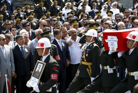 The flag-draped coffin of slain soldier Hamza Yildirim is carried by honour guards during a funeral ceremony at Kocatepe mosque in Ankara, Turkey, July 31, 2015. REUTERS/Umit Bektas