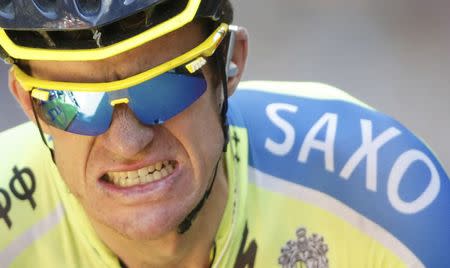 Tinkoff-Saxo team rider Michael Rogers of Australia celebrates as he crosses the finish line to win the 237.5km 16th stage of the Tour de France cycling race between Carcassonne and Bagneres-de-Luchon, July 22, 2014. REUTERS/Christian Hartmann