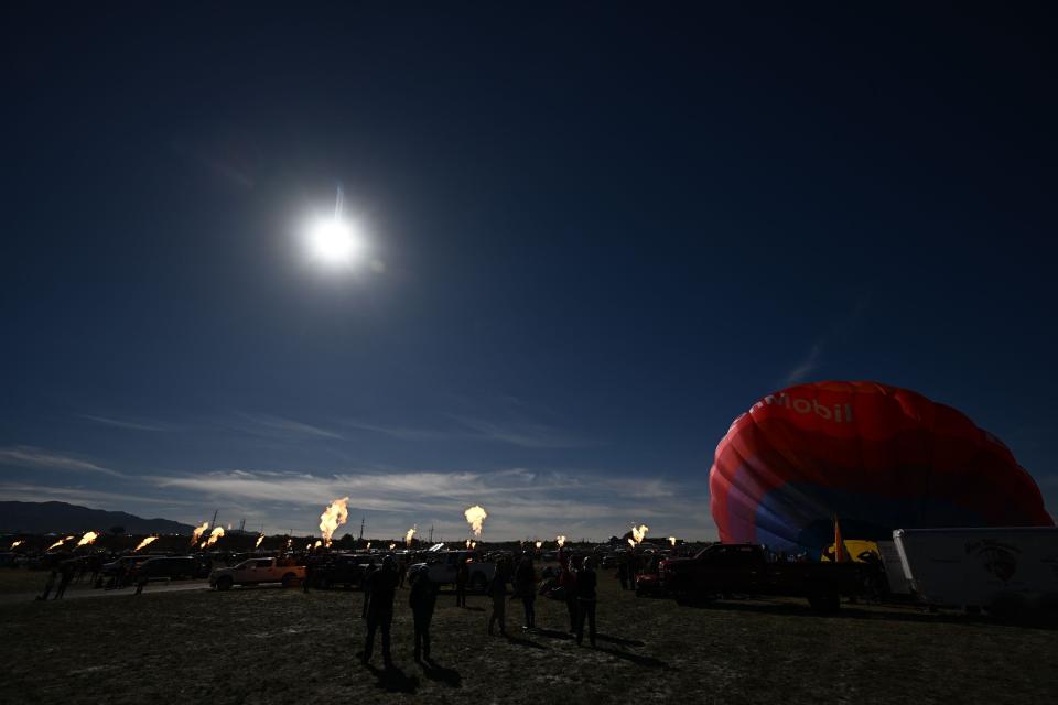 the sky darkens to a dark dusky blue during a solar eclipse