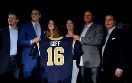 Apr 29, 2016; Los Angeles, CA, USA; Los Angeles Rams quarterback Jared Goff (second from (left) poses with general manager Les Snead (left) sister Lauren Goff (third from left), mother Nancy Goff (third from right), father Jerry Goff (second from right) and coach Jeff Fisher at press conference at Courtyard L.A. Live to introduce Goff as the No. 1 pick in the 2016 NFL Draft. Mandatory Credit: Kirby Lee-USA TODAY Sports