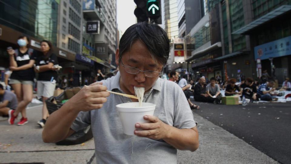 A man eating noodles