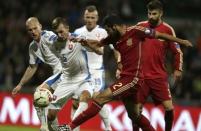 Raul Albiol of Spain challenges Norbert Gyomber of Slovakia (L) during their Euro 2016 qualification soccer match at the MSK stadium in Zilina October 9, 2014. REUTERS/David W Cerny