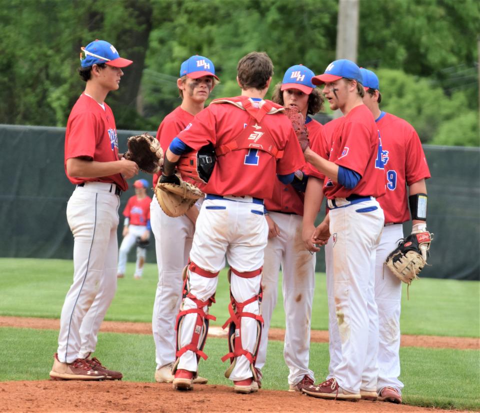 West Holmes senior pitcher Noah Clark chats with his infielders, from left, Nick Ginsburg, Hunter Aurand, Gino DiNardi, Micah Martin and catcher Dylan Robinson.