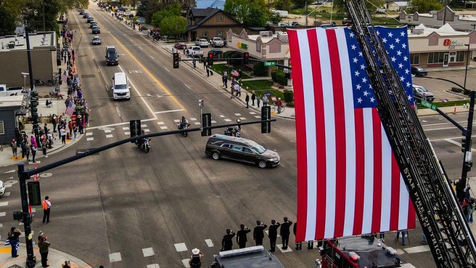 A two-hour-long procession of law enforcement vehicles escorts the late Tobin Bolter on the way to a funeral held Tuesday at the Ford Idaho Center. The procession began in Eagle and found the streets of Star lined with spectators waving flags, including the Star Fire Department saluting the hearse with a giant U.S. flag flying from a ladder truck.