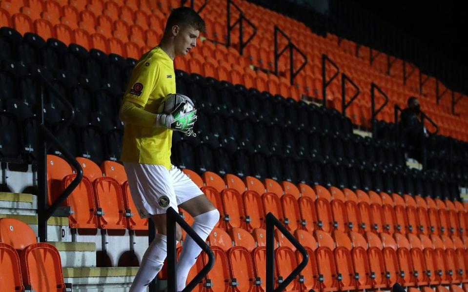 Goalkeeper Archie Mair of King's Lynn Town retrieves the ball himself to resume play during the Vananrama Conference match - Getty Images