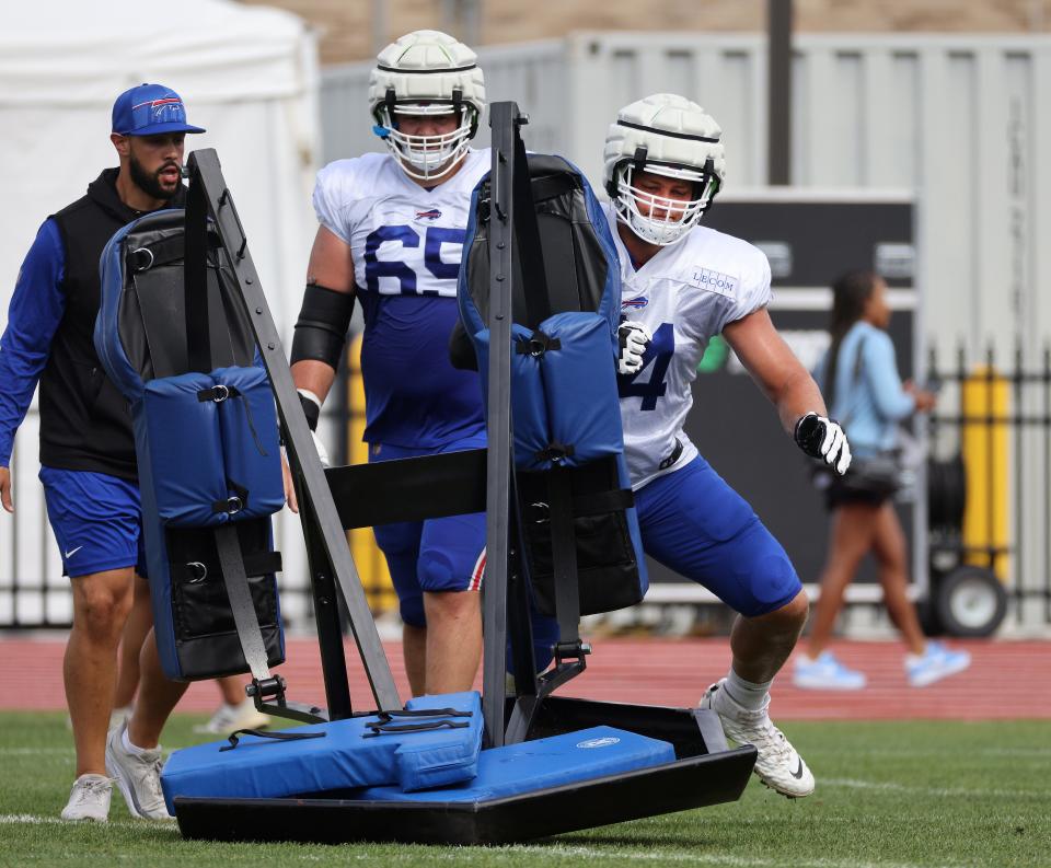 Bills offensive lineman Ryan Van Demark working the blocking sled during practice.