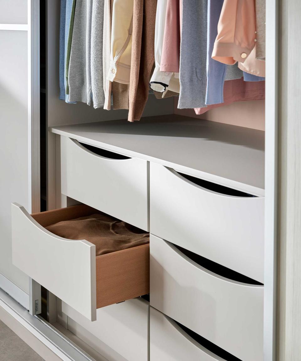 closet with drawers and hanging space