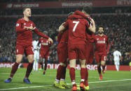 Liverpool players celebrate after Liverpool's Naby Keita scored his side's third goal during the English Premier League soccer match between Liverpool and Crystal Palace at Anfield in Liverpool, England, Saturday, Jan. 19, 2019. (AP Photo/Rui Vieira)