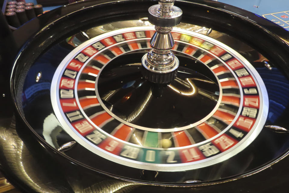 A roulette wheel spins during a game at the Hard Rock casino on May 17, 2023. On Jan, 16, 2023, New Jersey gambling regulators released statistics showing that Atlantic City's casinos, racetracks that accept sports betting and their online partners won nearly $5.8 billion from gamblers in 2023, a new record. But only three of the nine casinos won more from in-person gamblers last year than they did in 2019 before the coronavirus pandemic broke out. (AP Photo/Wayne Parry)