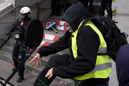 Demonstrators clash with police during the "yellow vests" protest against higher fuel prices, in Brussels, Belgium, December 8, 2018. REUTERS/Yves Herman