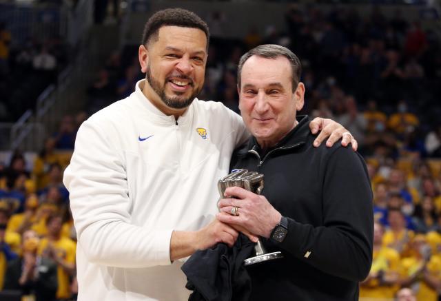 Mar 1, 2022; Pittsburgh, Pennsylvania, USA;  Pittsburgh Panthers head coach Jeff Capel (left) presents a trophy to Duke Blue Devils head coach Mike Krzyzewski (right) before their  game at the Petersen Events Center. Mandatory Credit: Charles LeClaire-USA TODAY Sports
