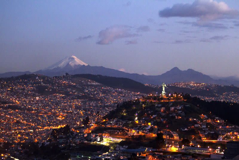 FILE PHOTO: Ecuador's capital city, Quito, is pictured with the Cotopaxi volcano in background