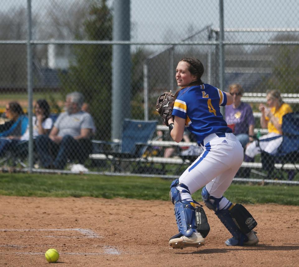 Lincoln junior Mallory Burns throws the ball to third base before a Wayne County Tournament game April 23, 2022.