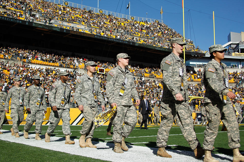 PITTSBURGH, PA - NOVEMBER 08:  Members of the United States Armed Forces spend a moment on the field at Heinz Field before the start of the 'Salute to Service' game between the Pittsburgh Steelers and Oakland Raiders on November 8, 2015 in Pittsburgh, Pennsylvania.  (Photo by Justin K. Aller/Getty Images)