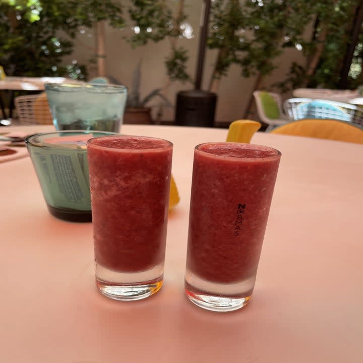 Two smoothie shots on brunch table