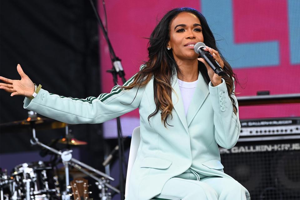 n this image released on July 1, Michelle Williams speaks onstage at the Get Lifted Gospel Sunday Celebration during the 2021 ESSENCE Festival Of Culture presented by Coca-Cola at University of New Orleans in New Orleans, Louisiana. Performance will air on July 4, 2021.