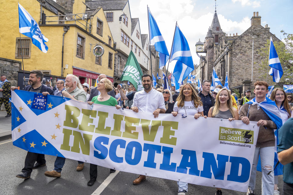 Yousaf (centre) takes part in a Believe in Scotland march from Edinburgh Castle in September 2023. (Getty)