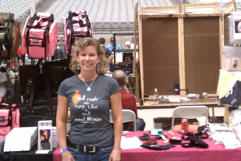 Carrie Lightfoot, founder of thewellarmedwoman.com, at her first gun show in 2012.