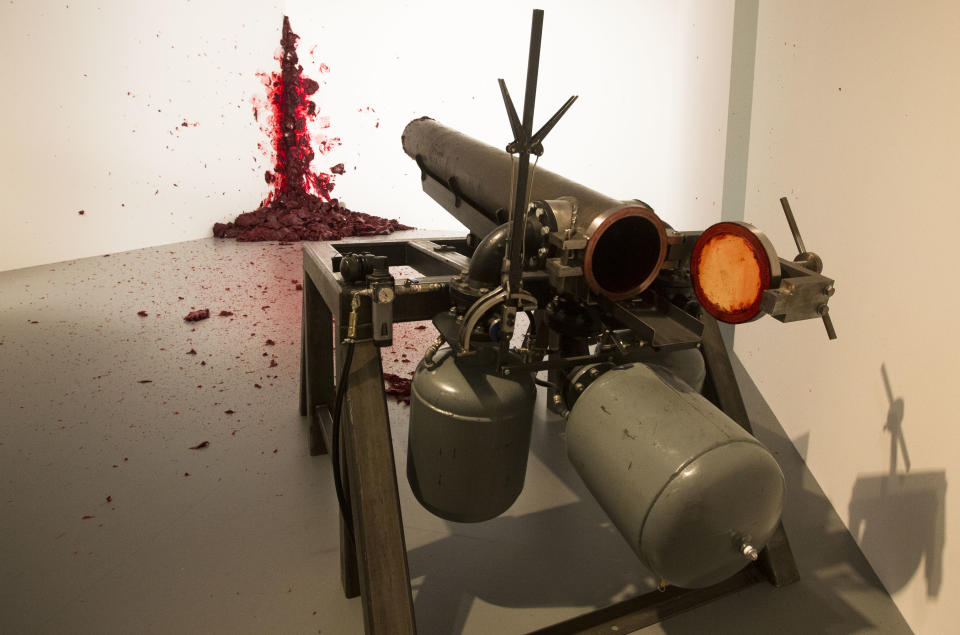 The art work 'Shooting Into The Corner' by Indian Artist Anish Kapoor is displayed at the exhibition 'Kapoor In Berlin' in the Martin-Gropius-Bau museum in Berlin, Friday, May 17, 2013. The exhibition will run from May 18, until Nov. 24, 2013. (AP Photo/Markus Schreiber)