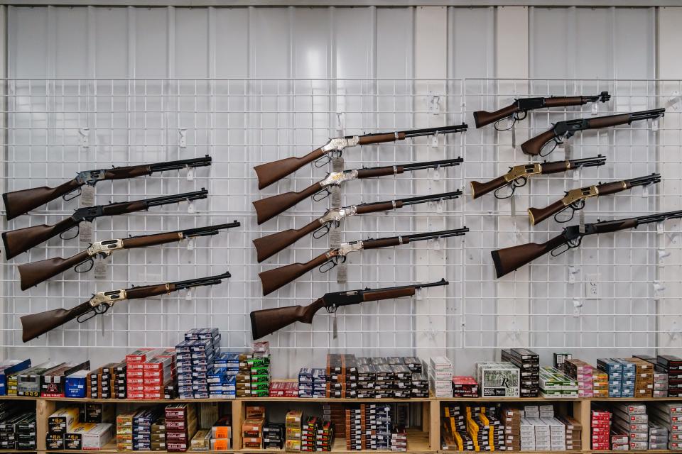 Henry Repeating Arms rifles and shotguns are displayed at Bullzeye Tactical and Hunting in Roswell. Store owner Christian Ervin said the brand is popular because it is made in the USA, is reliable and shoots well.