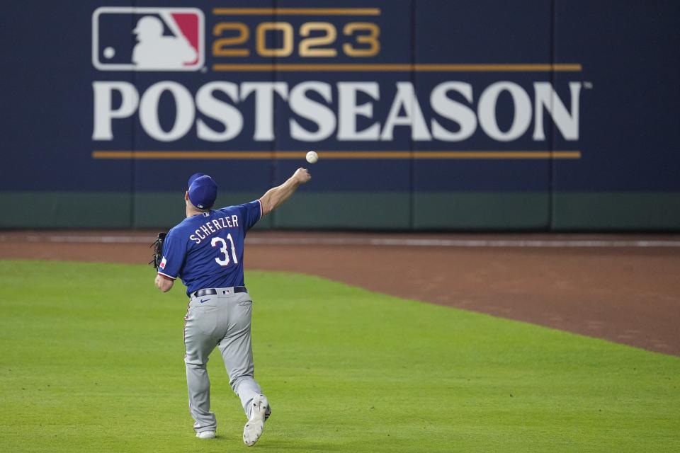 Texas Rangers starter Max Scherzer warms up before Game 7 of the baseball AL Championship Series against the Houston Astros Monday, Oct. 23, 2023, in Houston. (AP Photo/Tony Gutierrez)