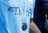 <p>Soccer Football – Premier League – Manchester City vs Huddersfield Town – Etihad Stadium, Manchester, Britain – May 6, 2018 A Manchester City player with his medal as he celebrates winning the Premier League title Action Images via Reuters/Carl Recine EDITORIAL USE ONLY. No use with unauthorized audio, video, data, fixture lists, club/league logos or “live” services. Online in-match use limited to 75 images, no video emulation. No use in betting, games or single club/league/player publications. Please contact your account representative for further details. </p>