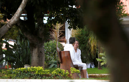 Followers of Brazilian spiritual healer Joao Teixeira de Faria, known as "John of God", are seen at "healing center" in his spiritual center, in Abadiania, Brazil December 13, 2018. REUTERS/Adriano Machado