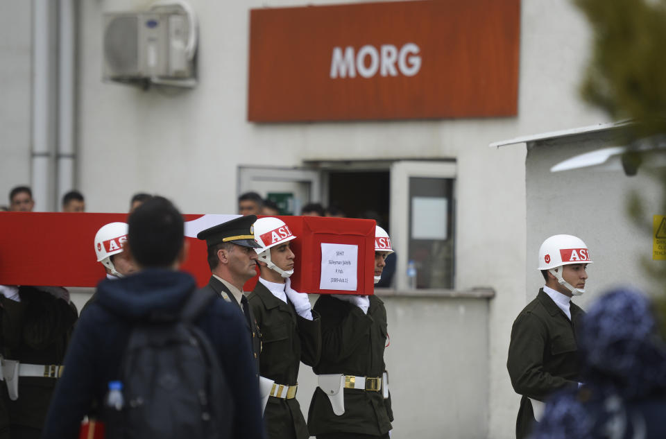 Honour guards carry the coffins of Turkish soldiers killed in Syria to the airport to be sent to their homelands, in Hatay, Turkey, Friday, Feb. 28, 2020. NATO envoys were holding emergency talks Friday at the request of Turkey following the killing of 33 Turkish soldiers in northeast Syria, as scores of migrants gathered at Turkey's border with Greece seeking entry into Europe. (AP Photo)