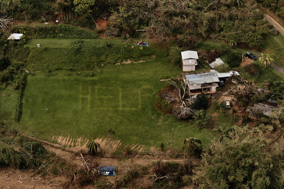 The desperate message “HELP” is seen on the lawn of a home near Utuado, Puerto Rico, in early October.