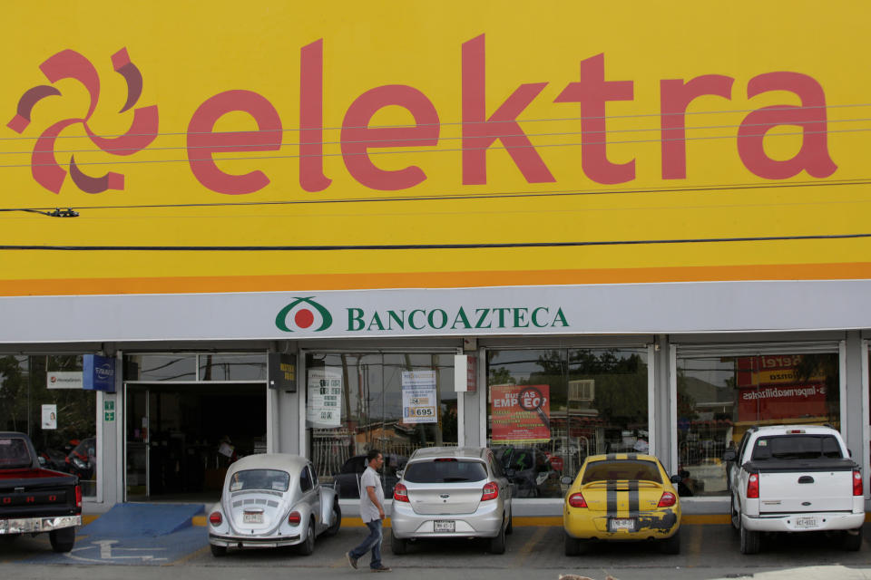 A man walks past a store of banking and retail company Elektra in Ciudad Juarez, Mexico, April 11, 2017. REUTERS/Jose Luis Gonzalez