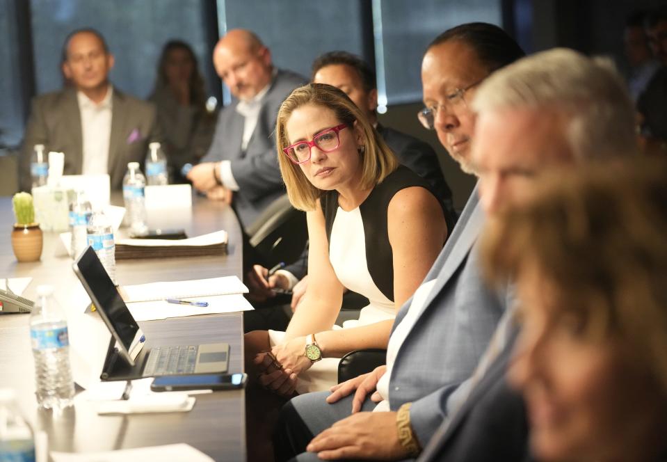 Sen. Kyrsten Sinema leads a council of water experts meeting in her office in Phoenix on Oct. 17, 2022. They were discussing how to spend federal drought relief funds available for keeping Colorado River water in Lake Mead.