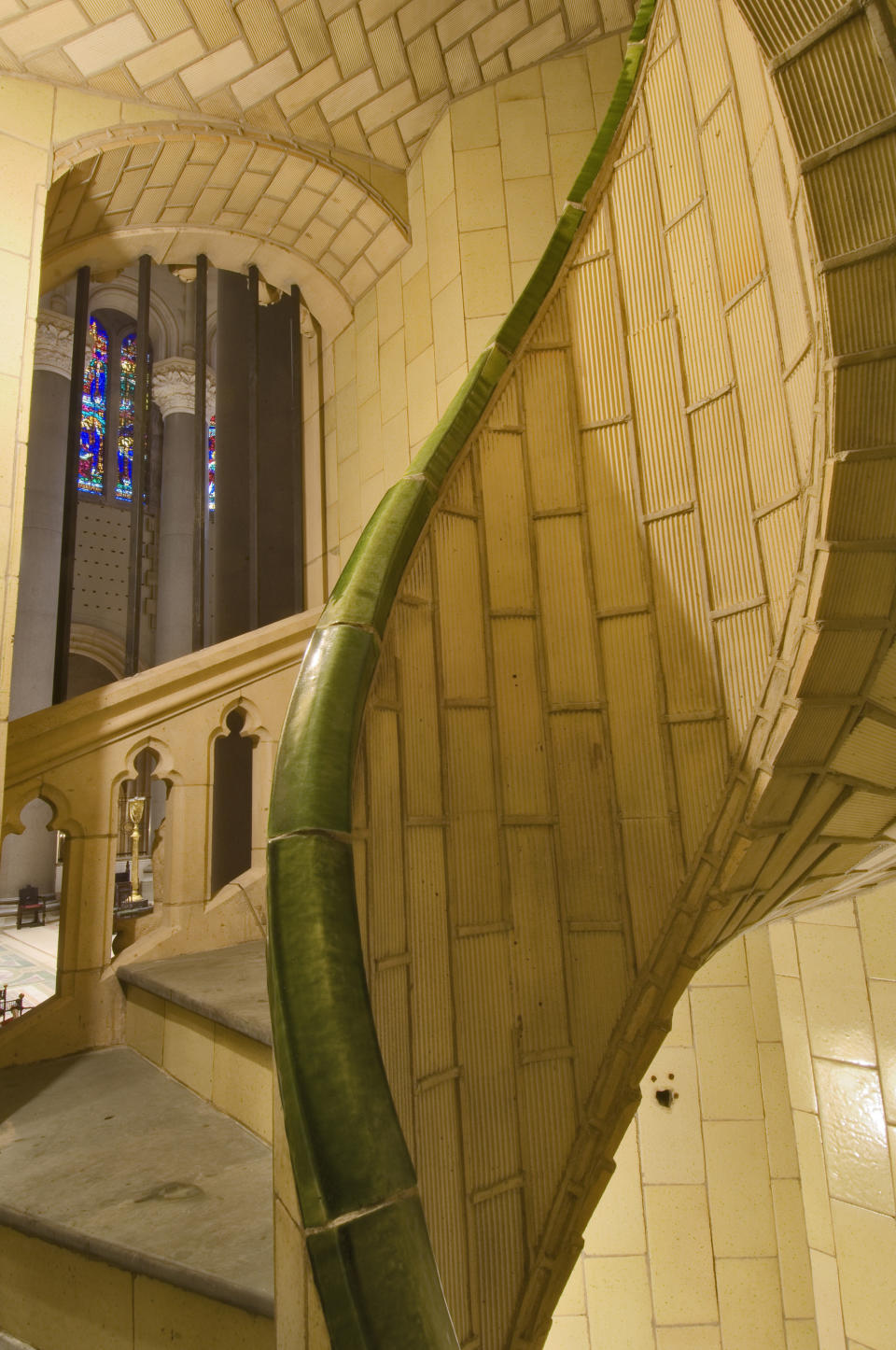 This undated photo, provided by the Museum of the City of New York, a section of New York's Cathedral of Saint John the Divine shows vaulted tile work from the Gustavino company featuring a spiral stair. Rafael Guastavino and his son Rafael Jr., are the subjects of the new exhibition "Palaces for the People: Guastavino and the Art of Structural Tile," a new exhibition opening March 26, 2014, at the City Museum. (AP Photo/Museum of the City of New York, Michael Freeman)