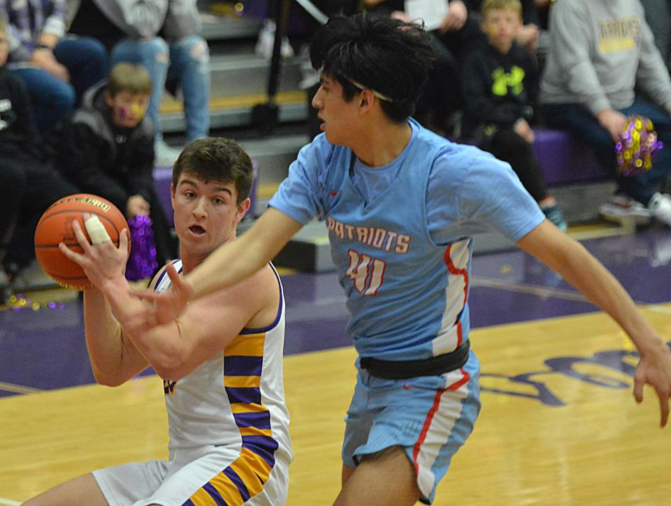 Watertown's Jake Olson is hounded by Sioux Falls Lincoln's Garry Crowe during their Class AA SoDak 16 state-qualifying boys basketball game on Saturday, March 2, 2024 in the Watertown Civic Arena. Watertown won 31-28.