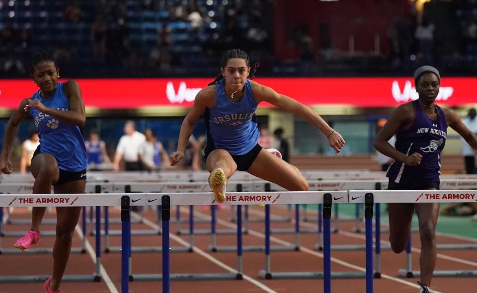 Ursuline's Elena Olson, center, wins the 55-meter hurdles with a 8.44 time during the Westchester County Track & Field Championships at Armory Track & Field Center on Saturday, Jan. 27, 2024.