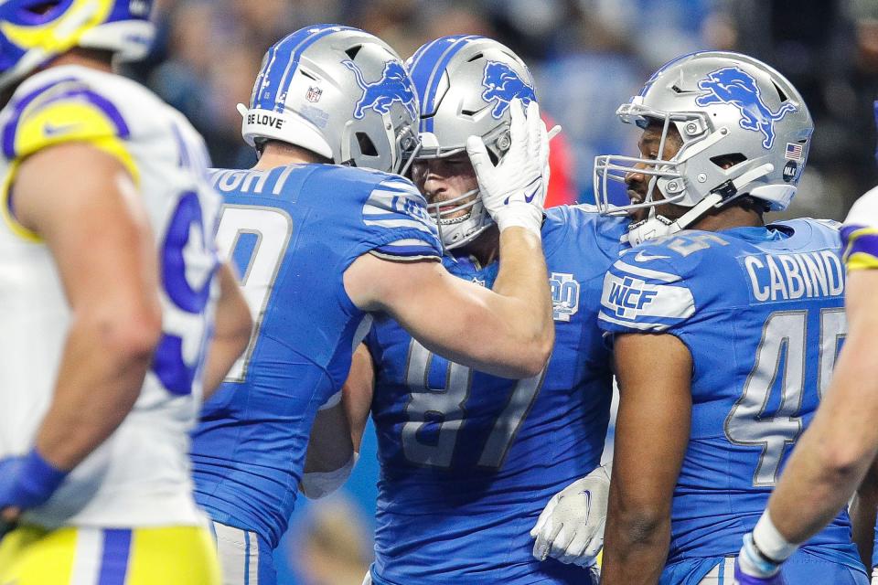 Detroit Lions tight end Sam LaPorta celebrates a touchdown against Los Angeles Rams during the first half of the NFC wild-card game at Ford Field in Detroit on Sunday, Jan. 14, 2024.