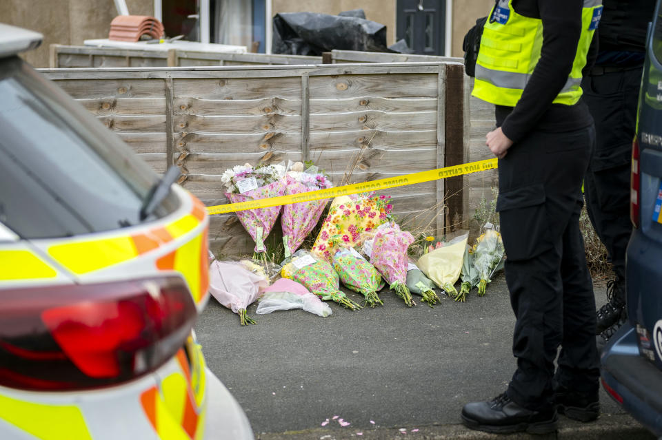 FILE PICTURE - Police, forensic officers and floral tributes at the Bradley Lewis stabbing scene in Chipperfield Drive, Kingswood, Bristol.  March 27, 2022. An OnlyFans model has admitted stabbing a father-of-four to death on the outskirts of Bristol.  See SWNS story SWBRtrial.  Bradley Lewis died after being knifed in the chest at the pair's home in Chipperfield Drive, Kingswood, at around 8.20pm on Friday, March 25 this year.  Appearing at Bristol Crown Court today (July 7), 24-year-old Abigail White pleaded guilty to a charge of manslaughter - but denies murder.  Adam Vaitilngam QC, prosecuting, confirmed the matter must proceed to trial on the murder charge.  A trial was set down for October 10. White was remanded in custody. 