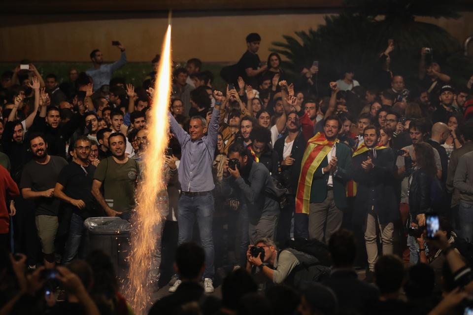 <p>A flare is let off as cowds gather to await the result of the Indepenence Referendum. (Getty) </p>