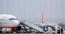 An aircraft transporting passengers from China is seen at an airport outside Kiev