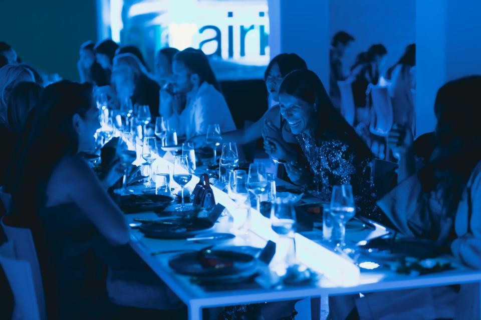 Guests dine together in MoMA PS1 to celebrate the launch of La Prairie's Skin Caviar Nighttime Oil.