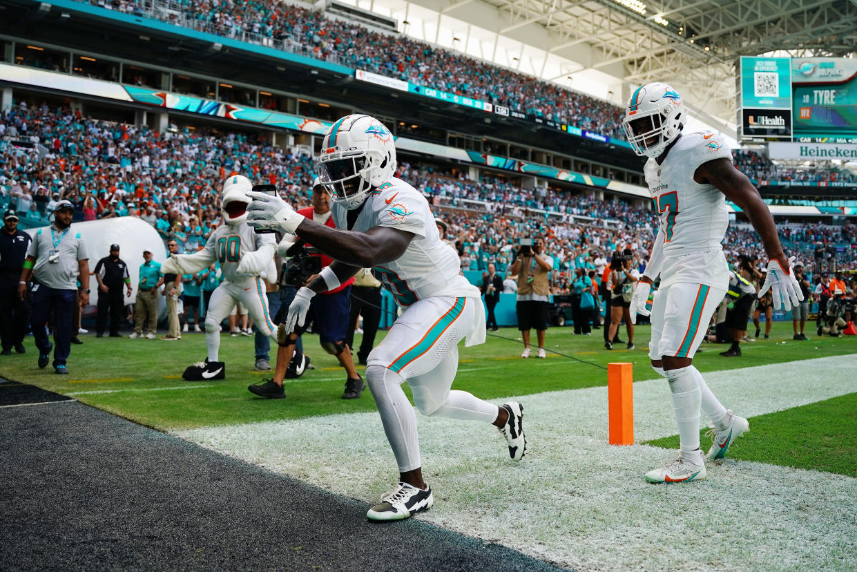 MIAMI GARDENS, FLORIDA - OCTOBER 15: Tyreek Hill #10 of the Miami Dolphins celebrates a touchdown during the first half in the game against the Carolina Panthers at Hard Rock Stadium on October 15, 2023 in Miami Gardens, Florida. (Photo by Rich Storry/Getty Images)