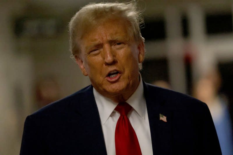 Former President Donald Trump speaks to reporters as he leaves his trial at Manhattan Criminal Court on Thursday after former National Enquirer published David Pecker testified that hush money payments to Karen McDougal were made illegally to protect Trump's 2016 campaign. Pool Photo by Jefferson Siegel/UPI