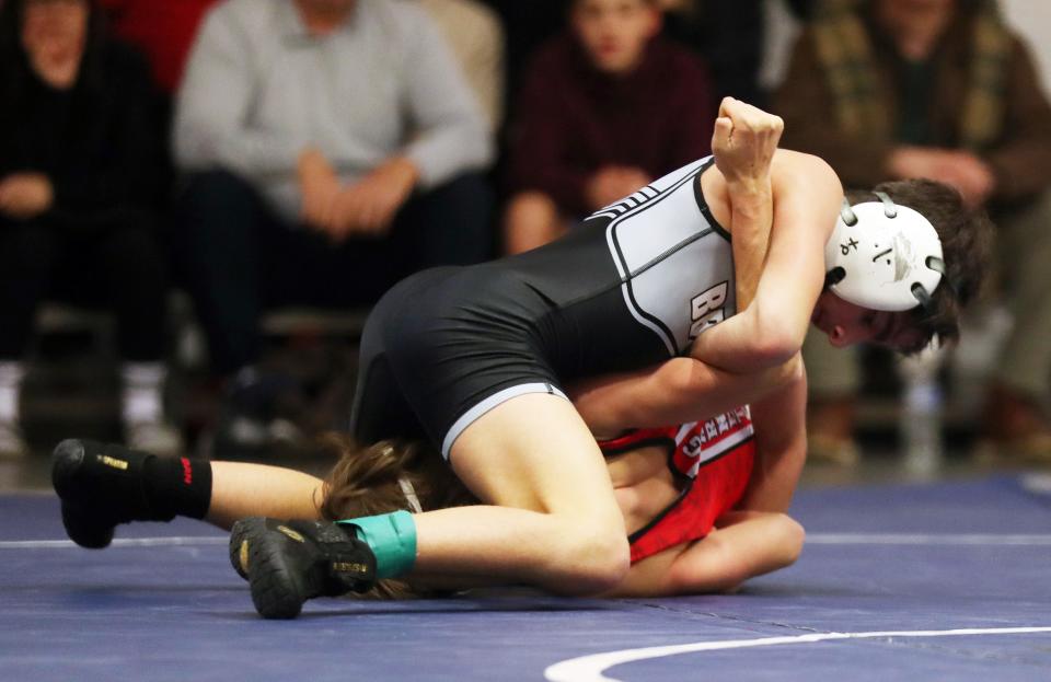 Byram Hills/Briarcliff/Valhalla/WestlakeÕs Vincenzo Mannello and RyeÕs Ari Bisongi wrestle in the 101-pound weight class during the dual meet quarterfinals at Byram Hills High School Dec. 19, 2023. Mannello won the match.