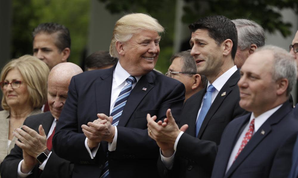 Donald Trump talks with House Speaker Paul Ryan of Wis., in the Rose Garden of the White House in Washington, Thursday, May 4, 2017. House Majority Whip Steve Scalise of La. is at left, House Ways and Means Committee Chairman Rep. Kevin Brady, R-Texas is at right.