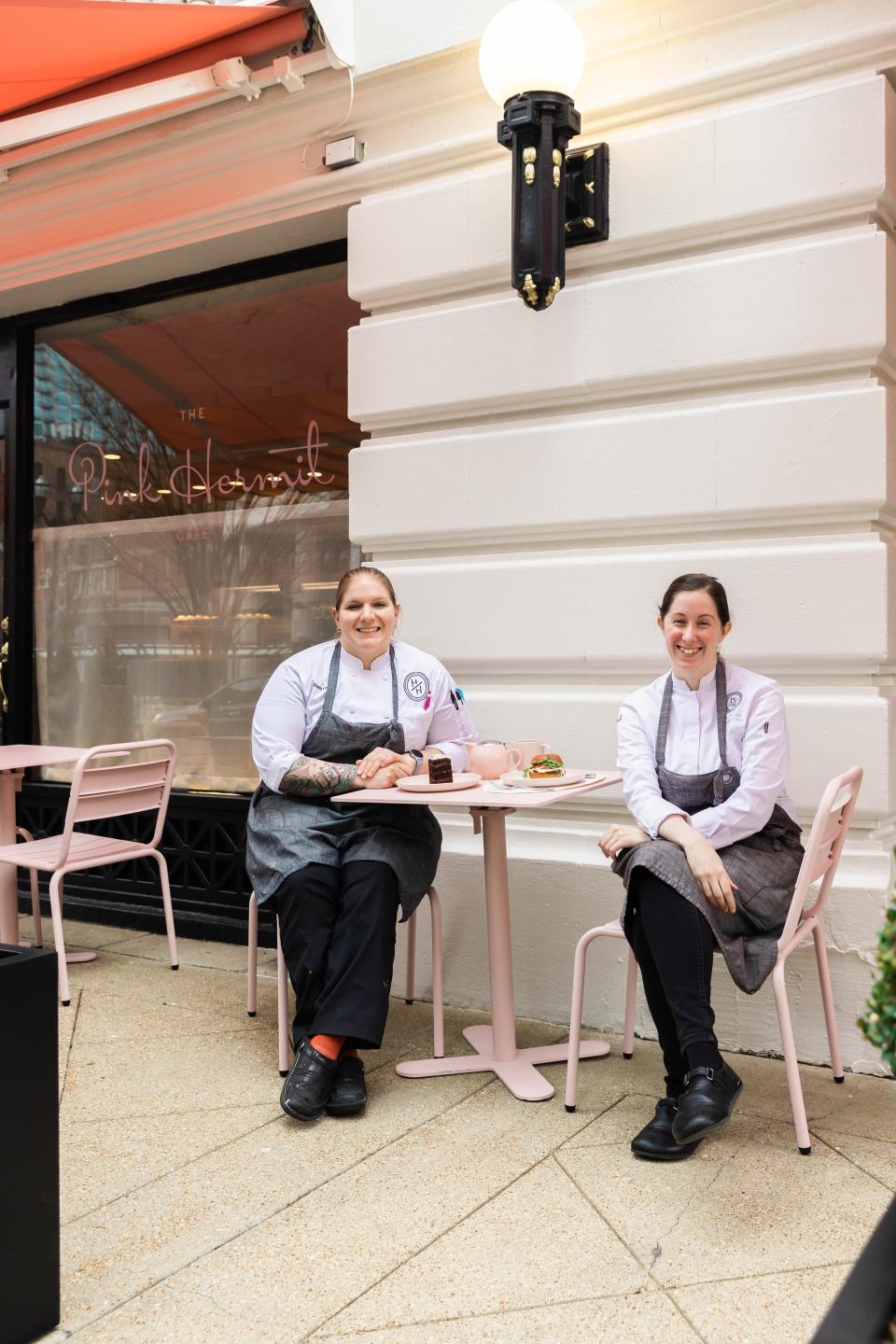 Executive pastry chef Stacy Day, left, and executive chef Kelsi Armijo sit outside The Pink Hermit, a Jean-Georges concept inside the historic Hermitage Hotel.
