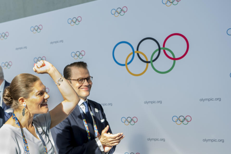 Sweden's Crown Princess Victoria, left, and Prince Daniel, right, react during the first day of the 134th Session of the International Olympic Committee (IOC), at the SwissTech Convention Centre, in Lausanne, Switzerland, Monday, June 24, 2019. The host city of the 2026 Olympic Winter Games will be decided during the134th IOC Session. Stockholm-Are in Sweden and Milan-Cortina in Italy are the two candidate cities for the Olympic Winter Games 2026. (Jean-Christophe Bott)/Keystone via AP)