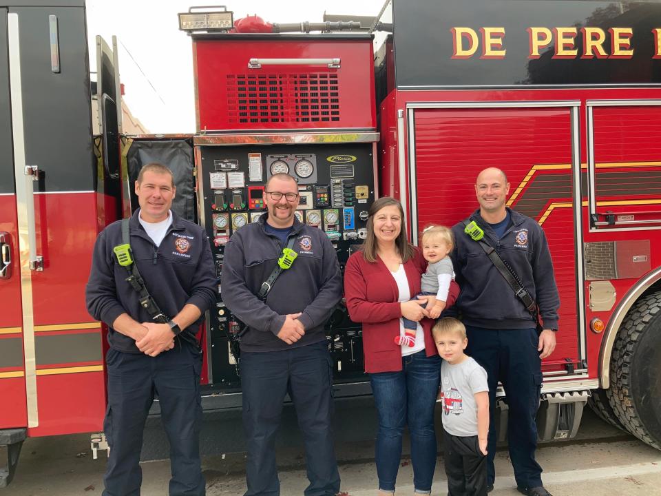 From left to right, Brett Jansen, battalion chief paramedic, Tony Rottier, paramedic, Tammy Gossen, Ainsley Gossen, Owen Gossen, and Neal Schweiner, paramedic, at De Pere Fire Station on Friday in De Pere.