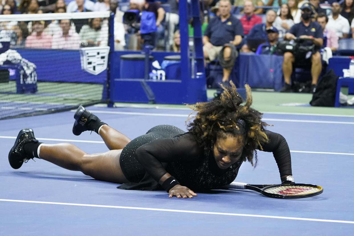 Serena Williams, of the United States, falls during a match against Ajla Tomljanovic, of Australia, during the third round of the U.S. Open tennis championships, Friday, Sept. 2, 2022, in New York. (AP Photo/John Minchillo)